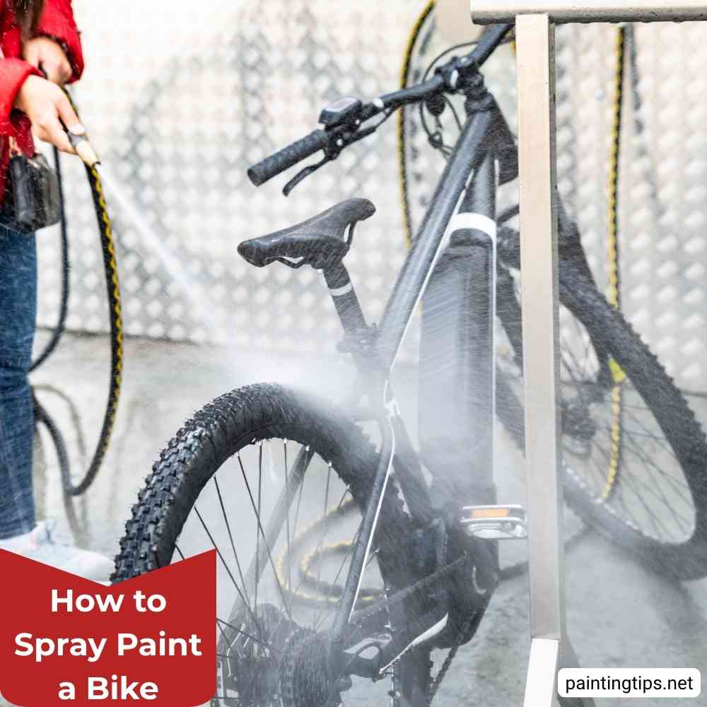 Ppray painting a bicycle.